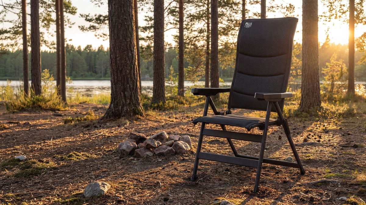 Friends in portable outdoor chairs gathered at a backyard fire pit on a fall evening
